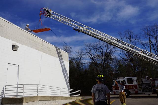 Removing a medical victim from a roof.