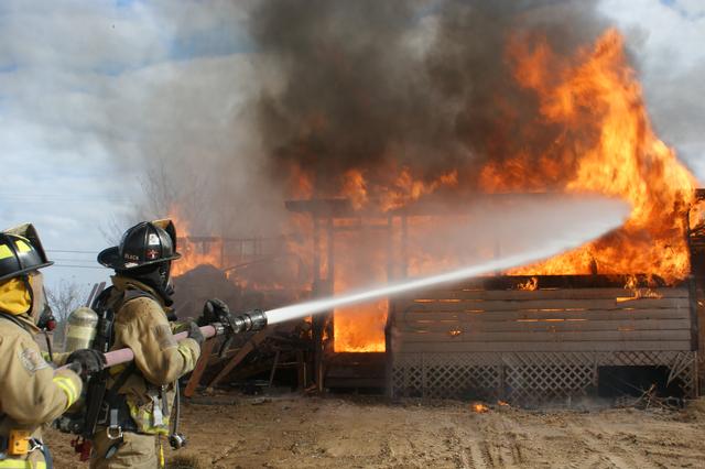 Training Burn, exterior attack of a fully involved structure transitioning from a defensive attack to an offensive interior attack.