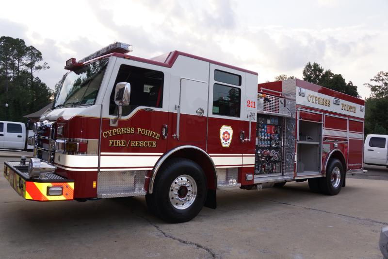 Engine 211 has 1,500 gallon per minute pump, and carries a 1,000 gallons of water. It is also equipped with a Compressed Air Foam System (CAFS) which uses Class A Foam for fighting ordinary combustible fires whether it is a structure fire or a woods fire. The engine also has a 10kw generator and a extend-a-gun deluge gun which allows for flowing water above the cab of the truck. The cab has seating for the driver, the office and three firefighters with compartments for medical response equipment. The trucks front grill has the first state flag grill in North Carolina, the rear compartment has a 9/11 memorial tribute to include the World Trade Center and all of the responding fire units that lost members during the World Trade Center attacks. The emblem is outlined by a pentagon in remembrance of the attacks on the U.S. Pentagon. Engine 211 is housed at Station 1 & responds to all 1st due in Station 1 district  